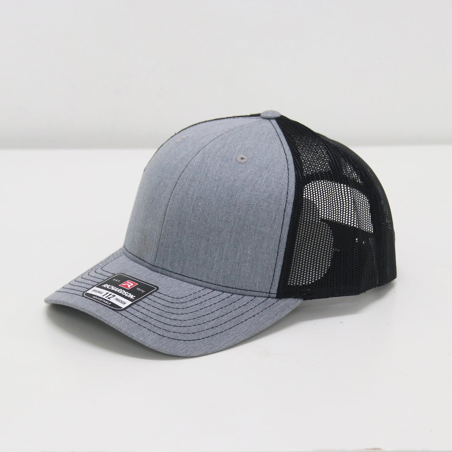 Gray and black baseball cap on a white background
