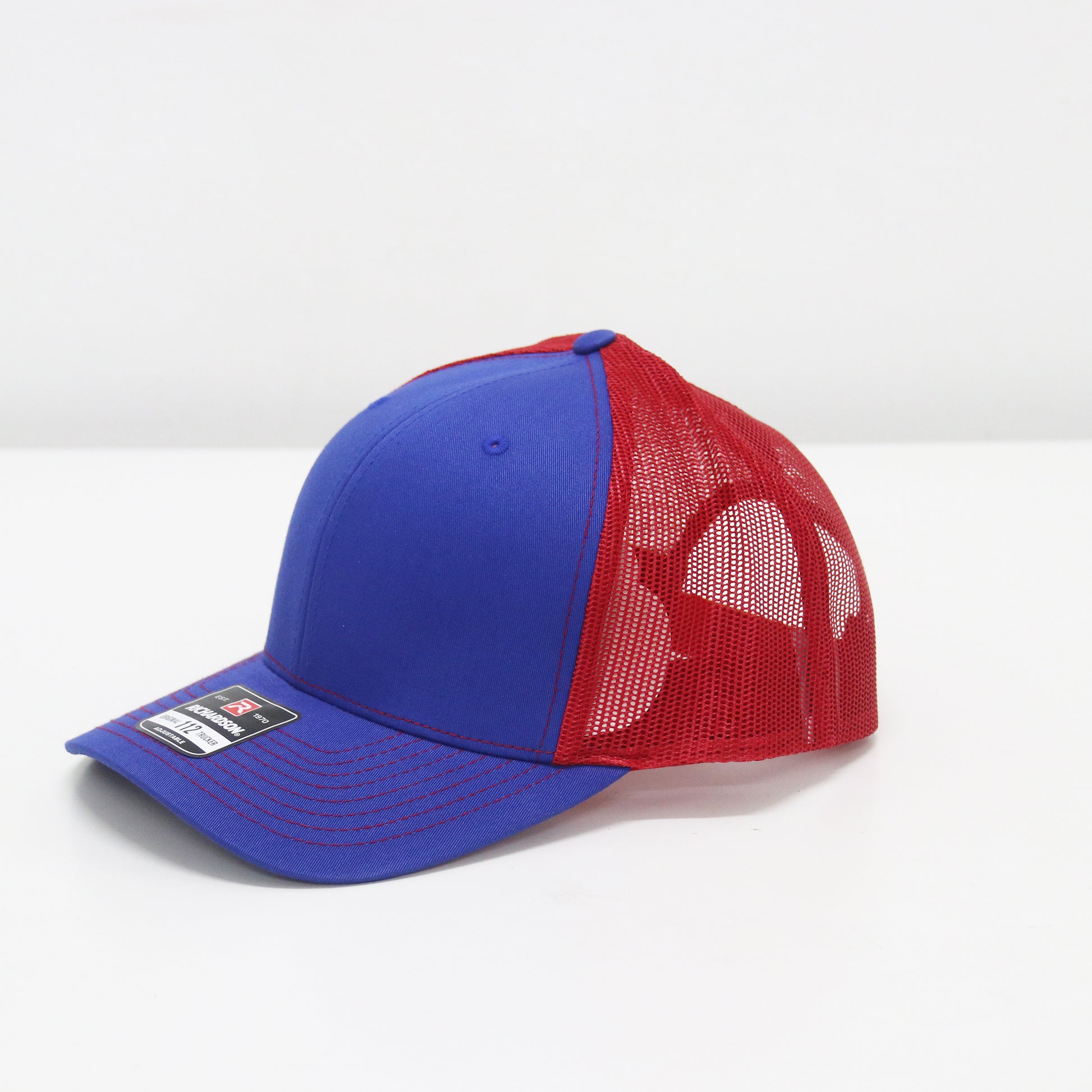 Blue and red baseball cap on a white background
