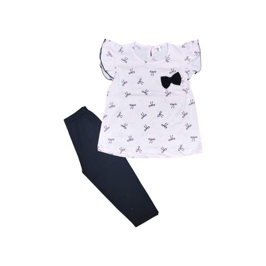 White blouse with black bow and dark pants on a white background