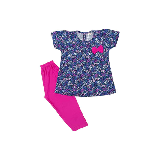 Children's outfit with floral top and pink pants on a white background