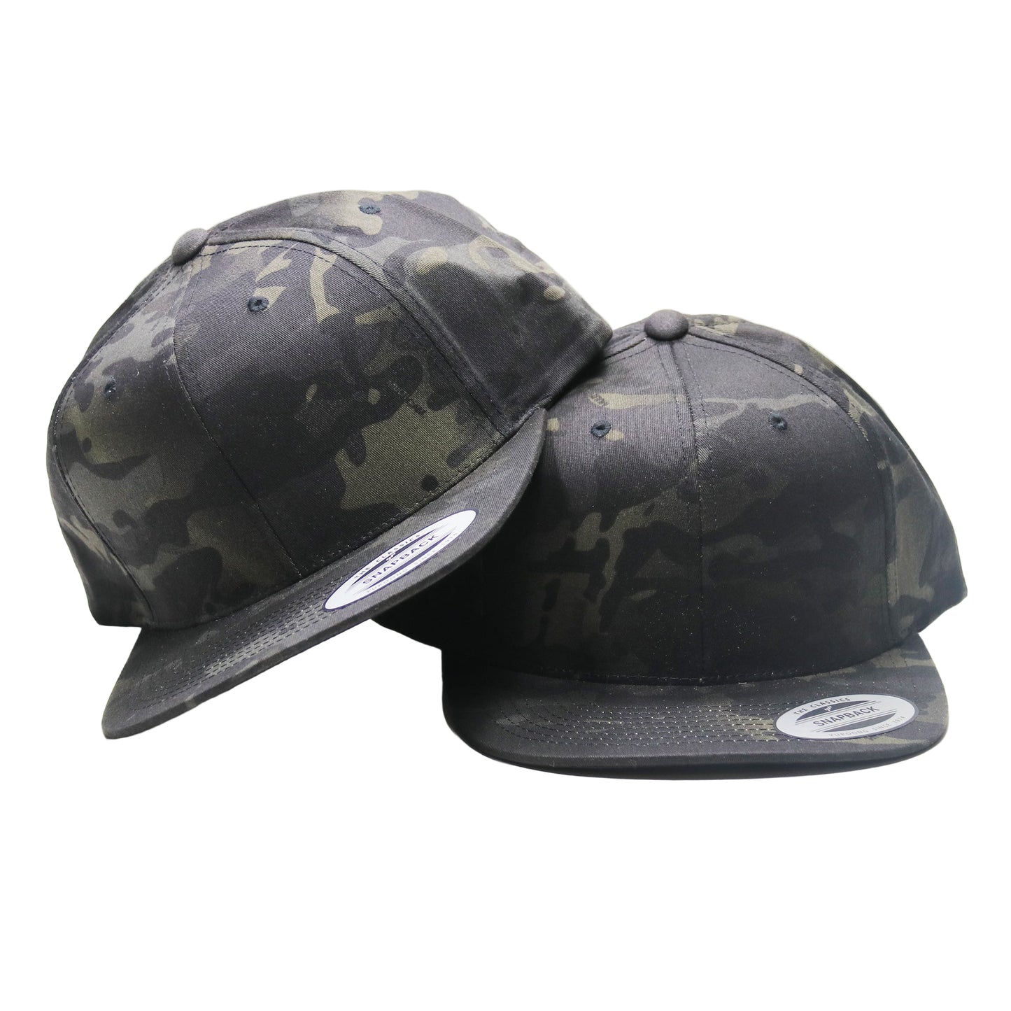 Two camouflage baseball caps on a white background