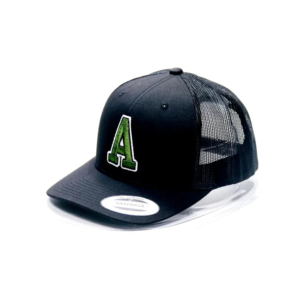 Black trucker cap with green letter 'A' logo on a white background