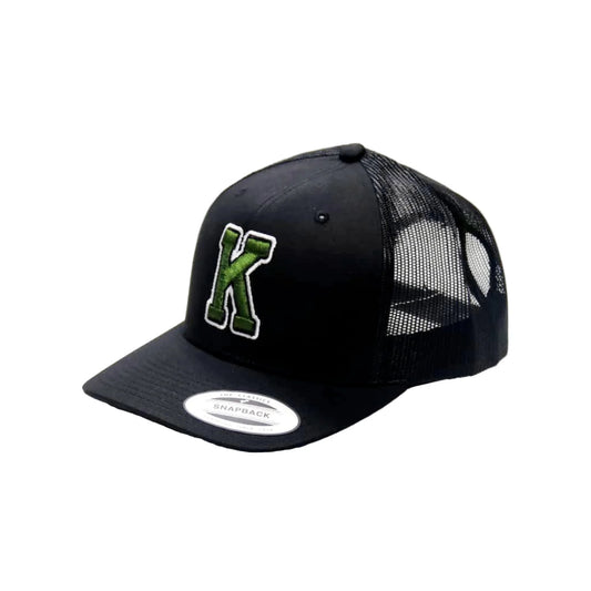 Black cap with green logo on a white background