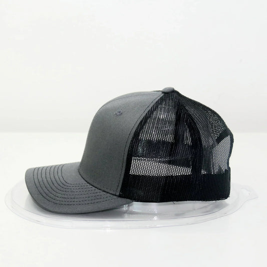 A gray trucker cap with a curved brim and a mesh back.