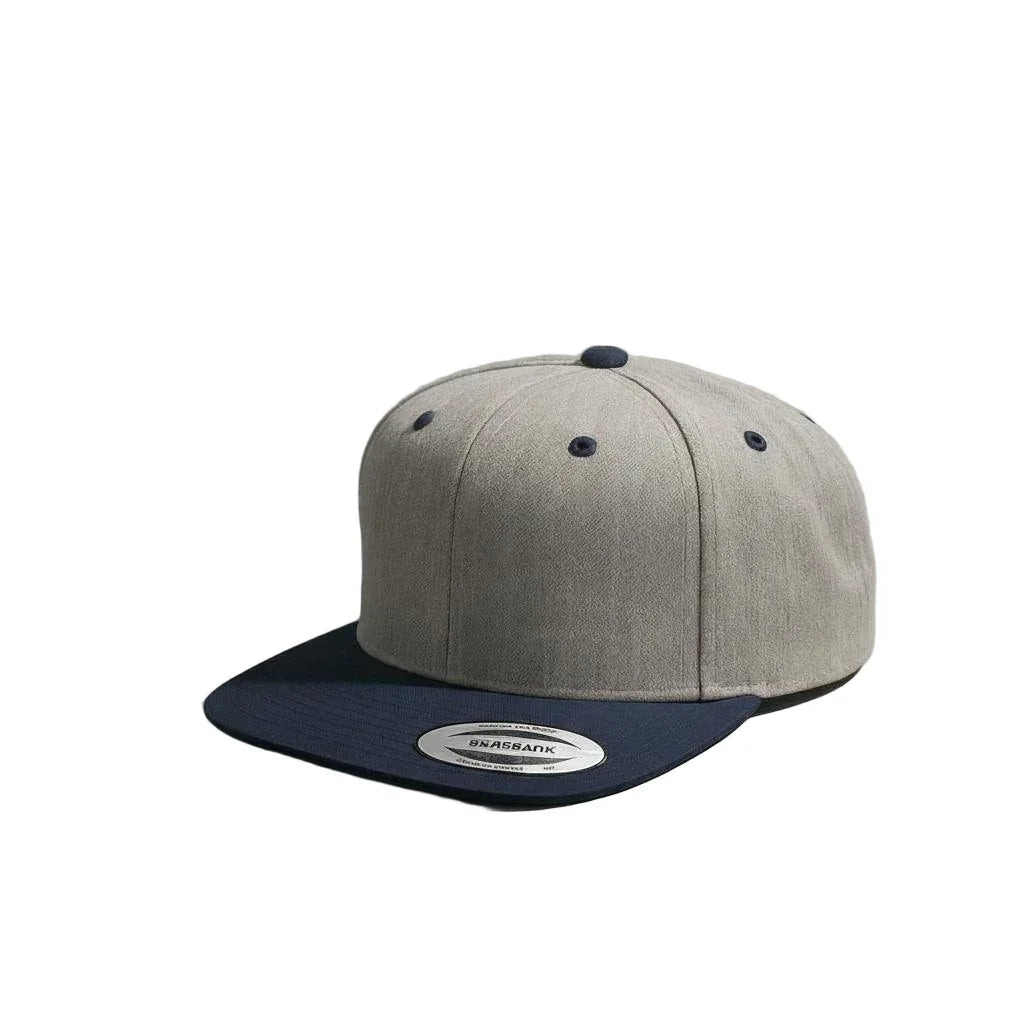 Gray and navy cap on a light gray surface with 'Skrapcap' branding.