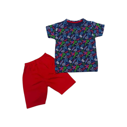 Children's outfit with a patterned shirt and red shorts on a white background