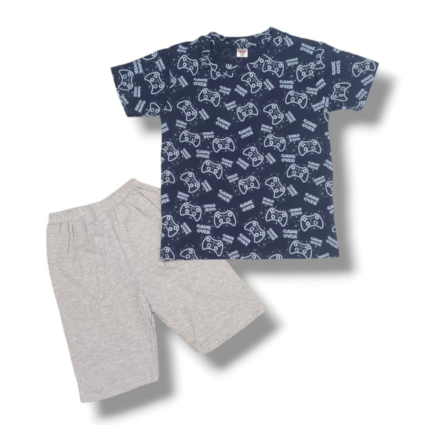 Children's navy t-shirt with white graphics and gray shorts on a white background