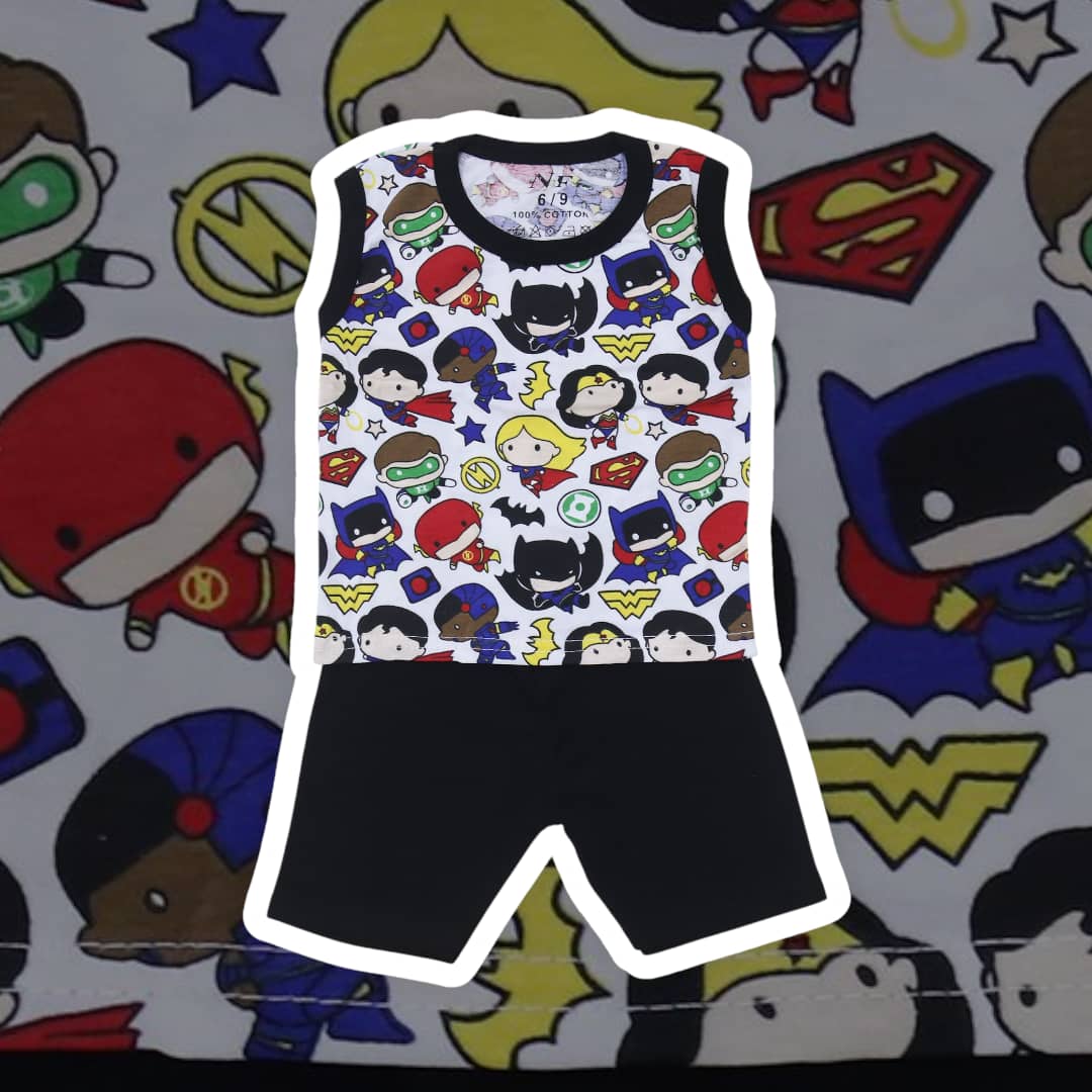 Tank top with superhero pattern and black shorts on a colorful background