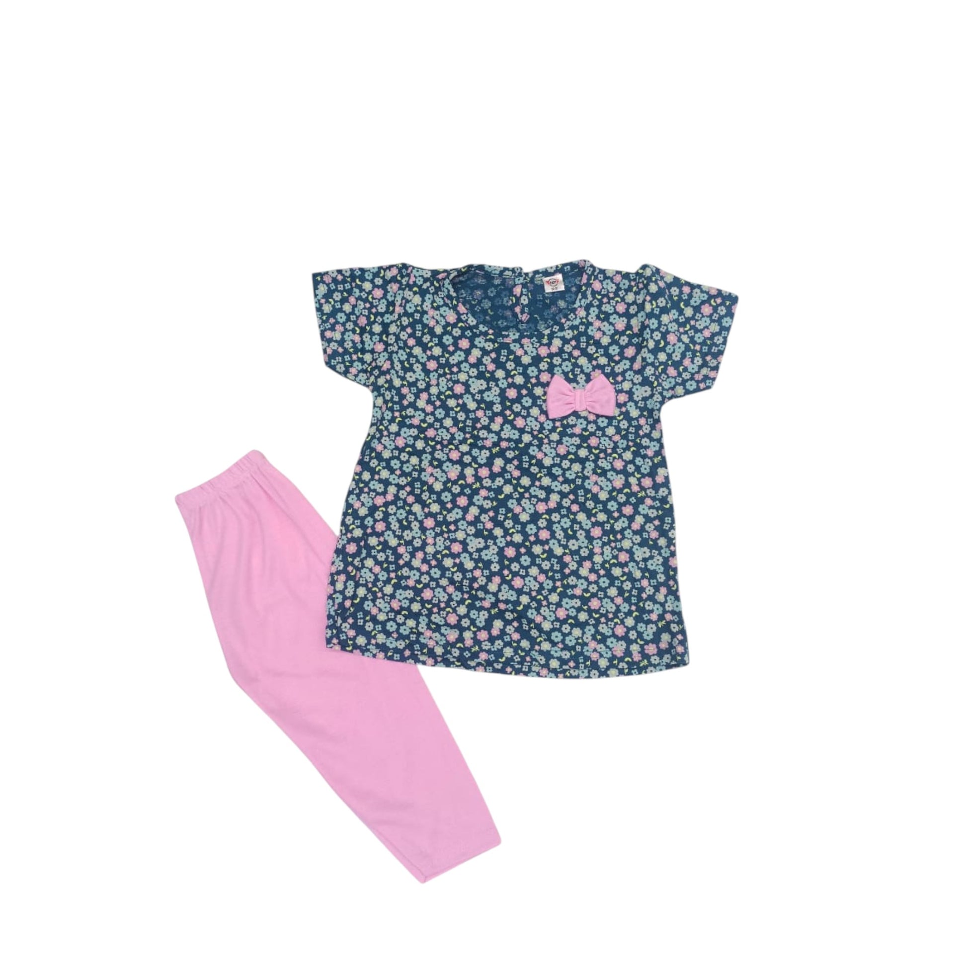 Floral top and pink pants set on a white background