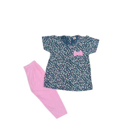 Floral top and pink pants set on a white background