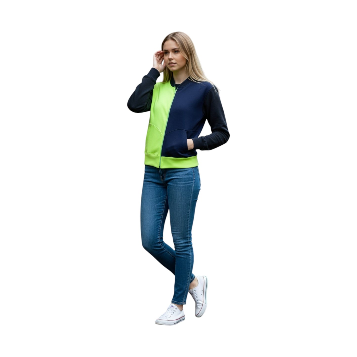 Woman wearing a navy and green jacket with blue jeans on a white background