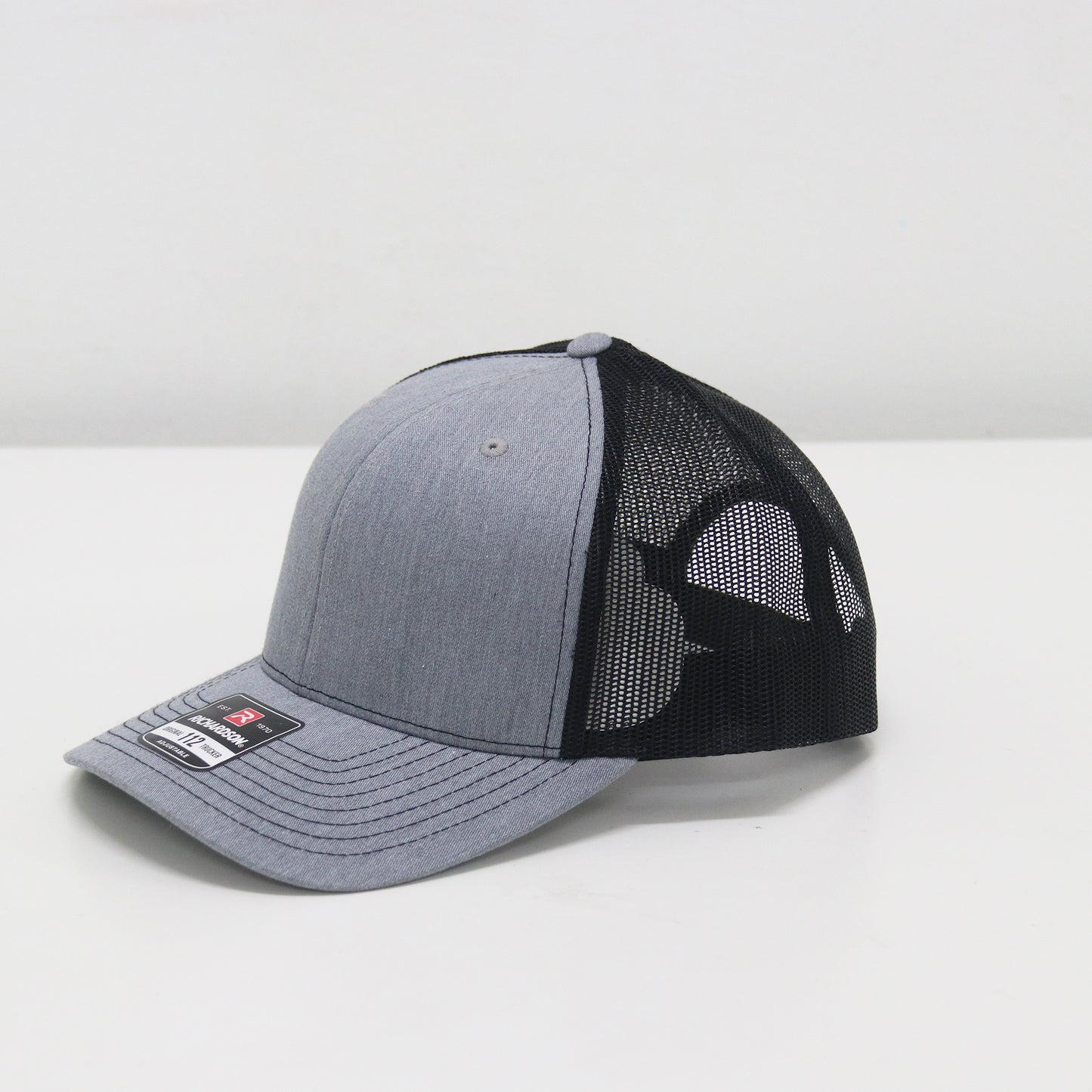 Gray and black baseball cap on a white background