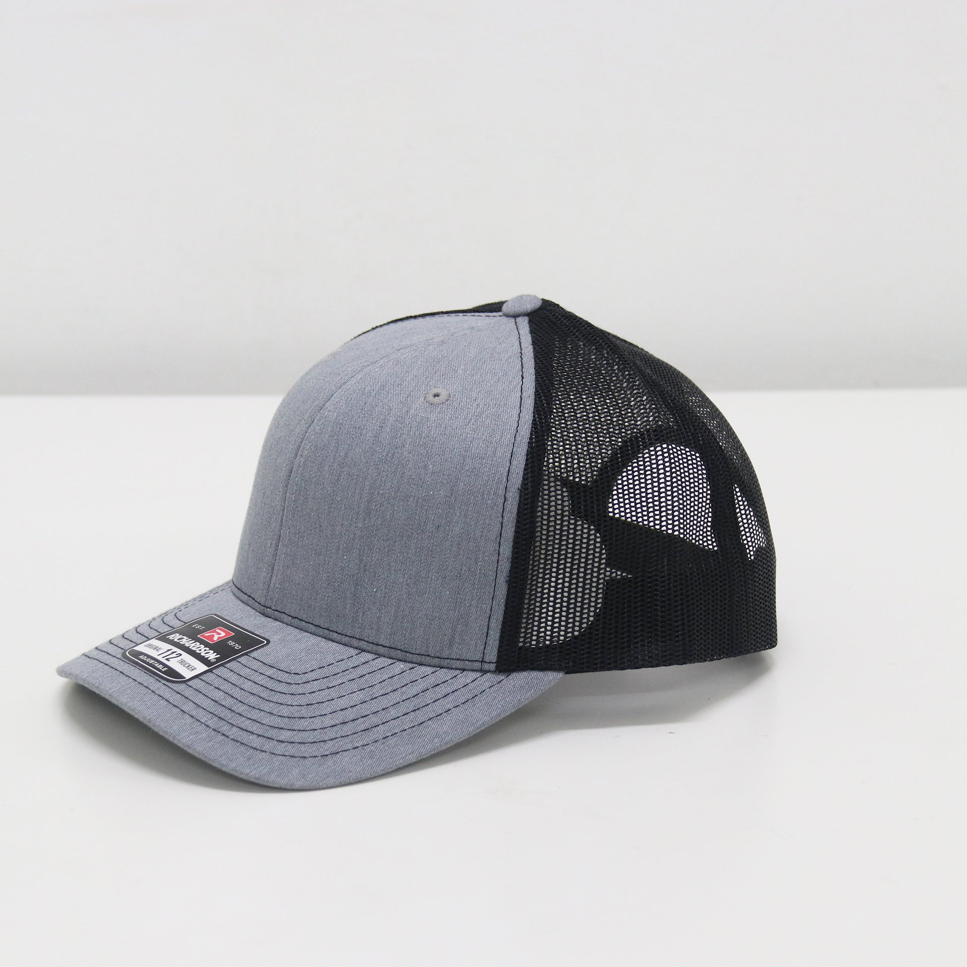 Gray and black baseball cap on a white background