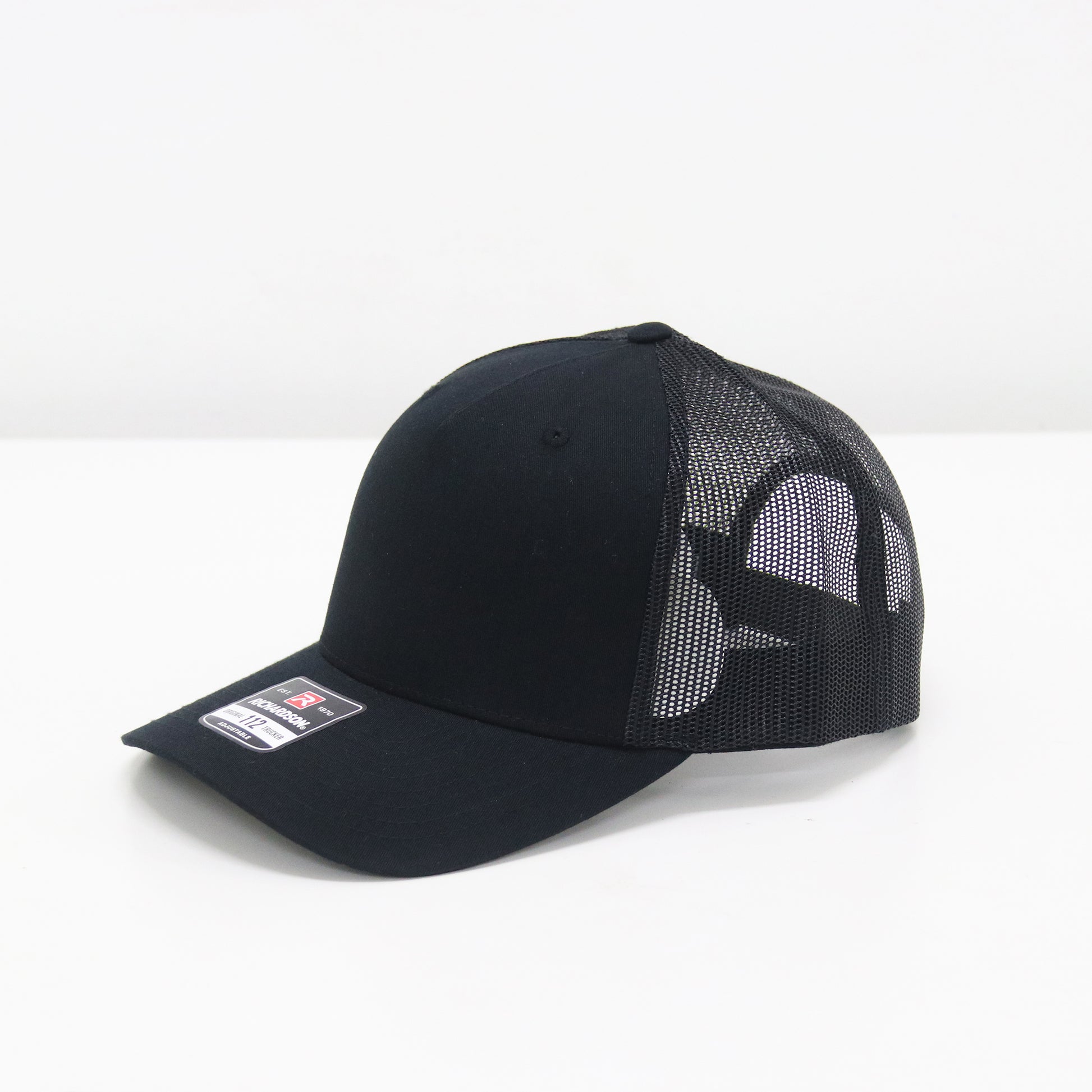 Black cap with mesh back on a white background