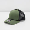Green cap with black mesh back on a white background