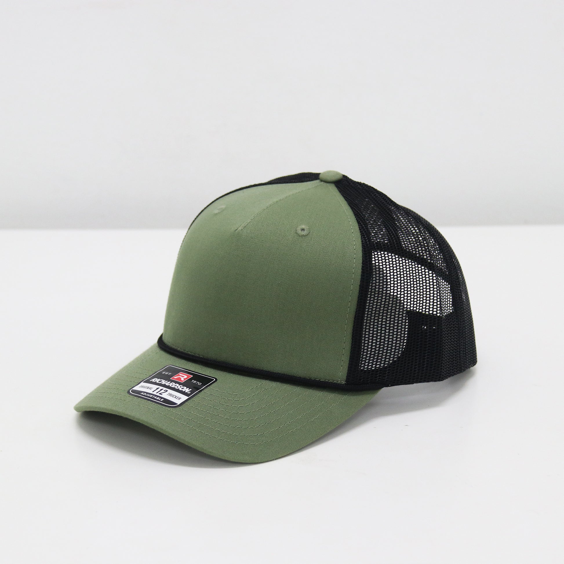 Green cap with black mesh back on a white background