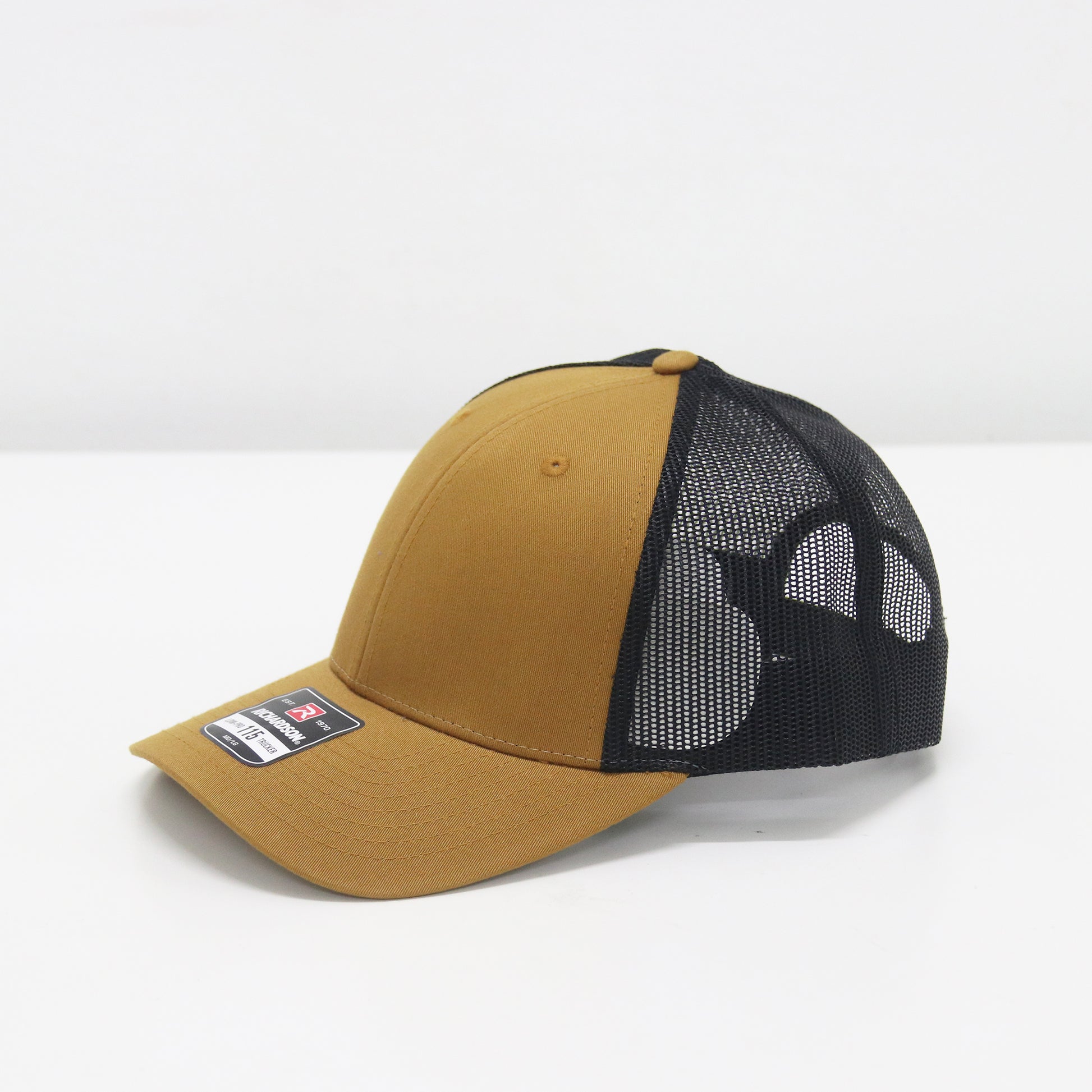Brown and black cap with mesh back on a white background
