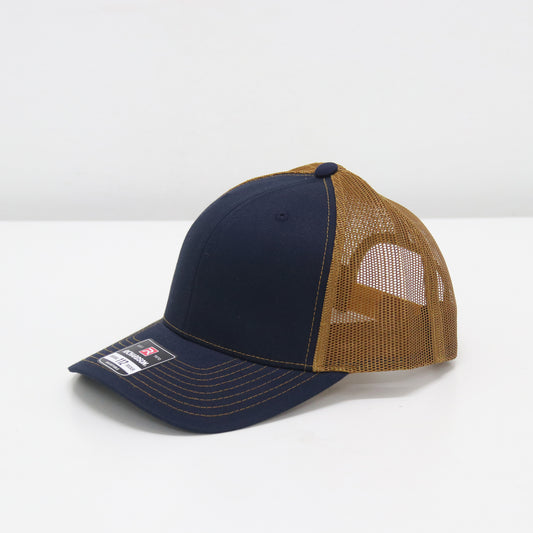 Navy and brown trucker cap on a white background