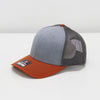 Gray and orange baseball cap on a white background