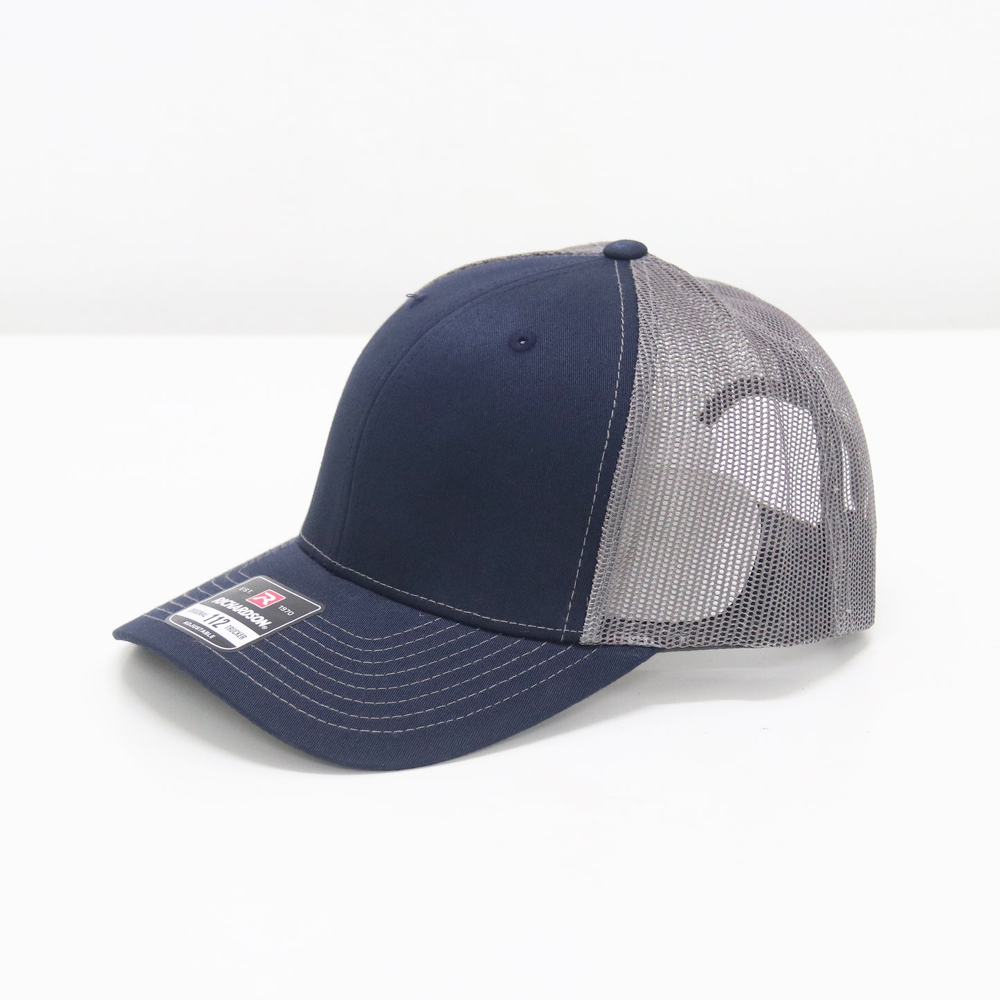 Navy and gray cap with mesh back on a white background