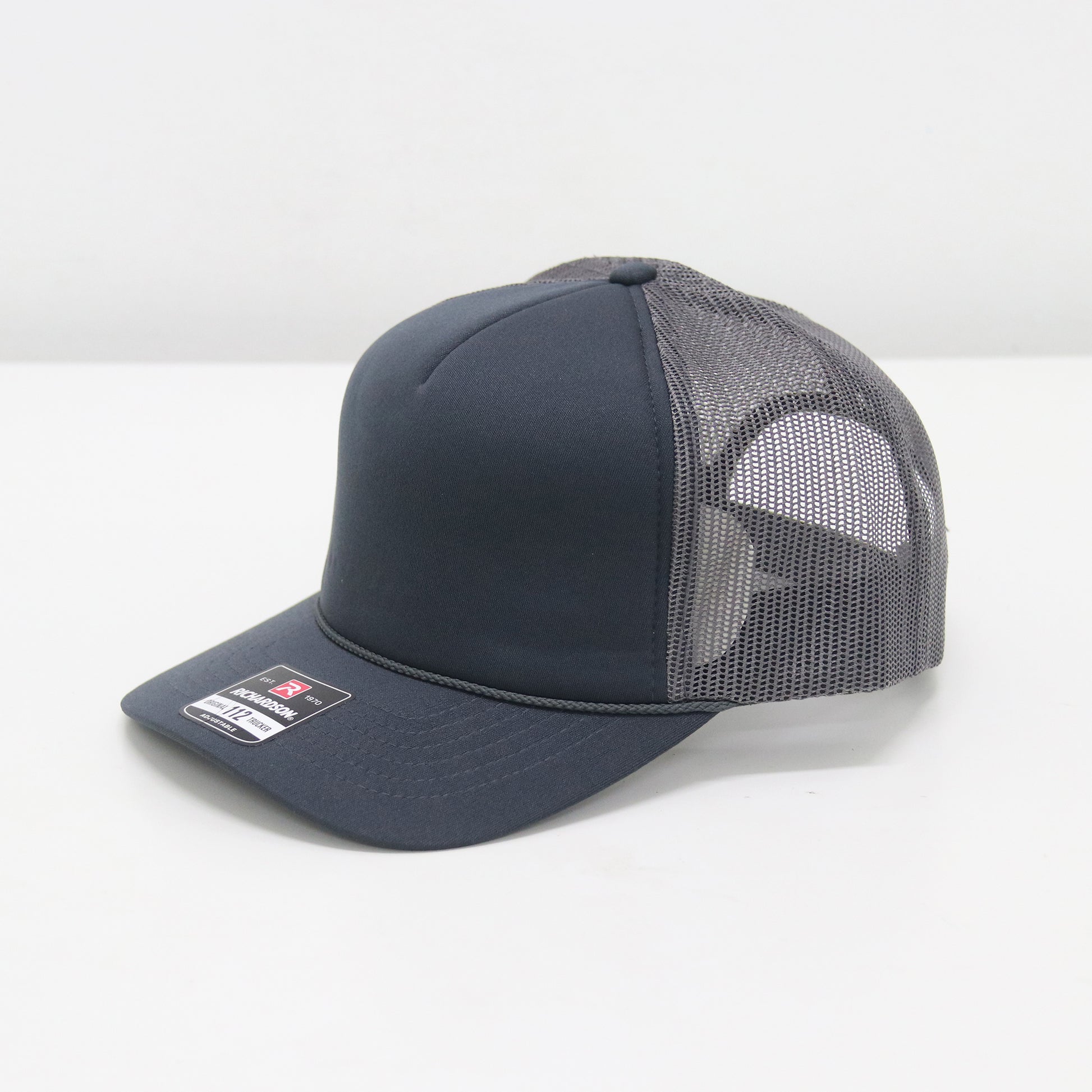 Navy blue cap with mesh back on a white background