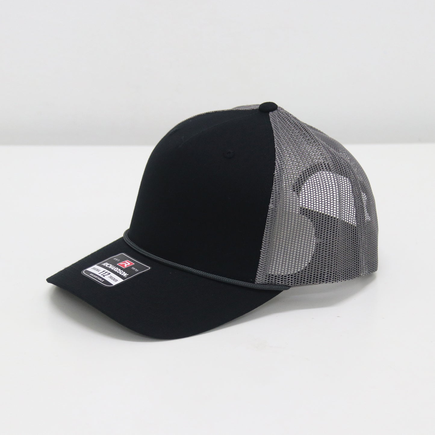 Black and gray mesh cap on a white background