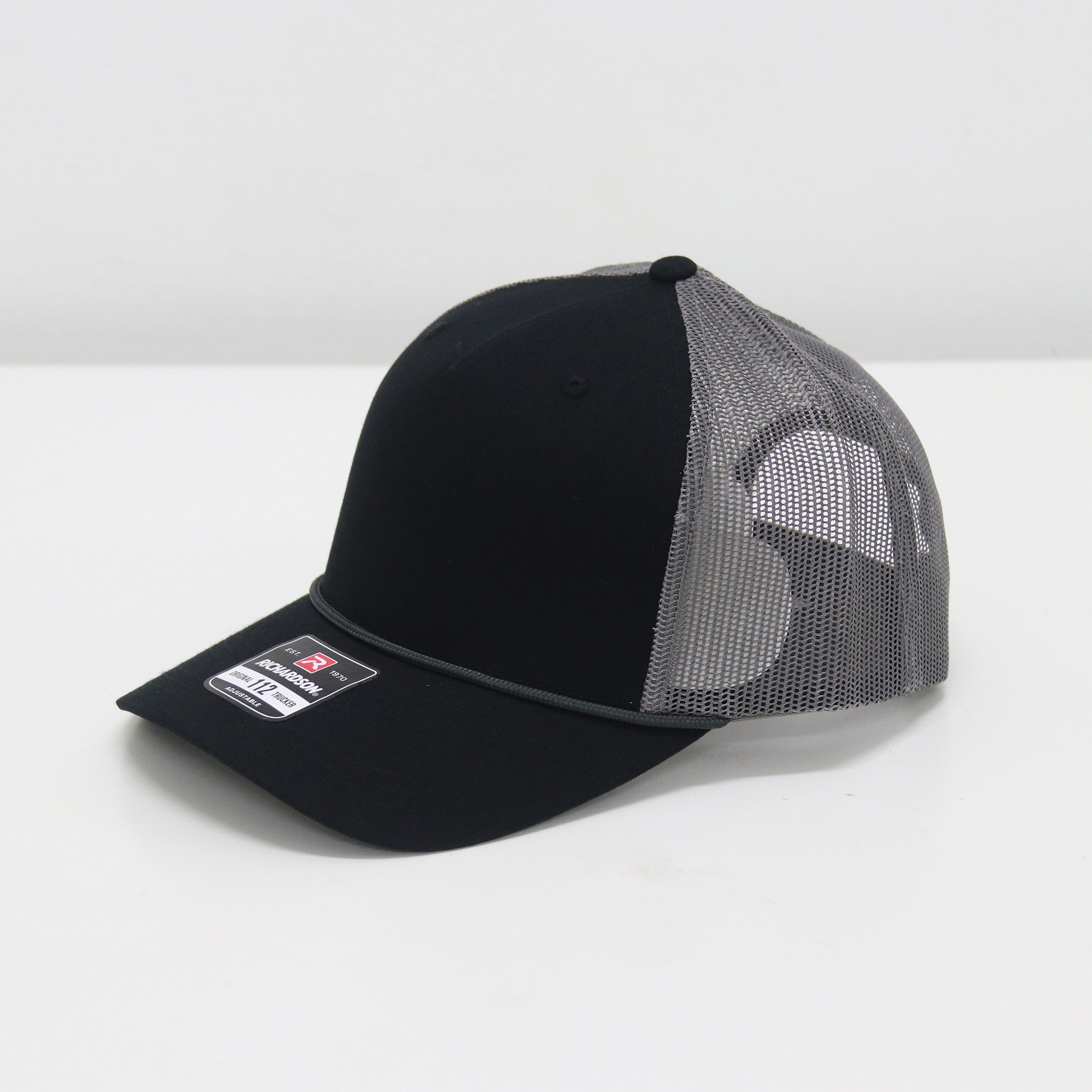 Black and gray mesh cap on a white background