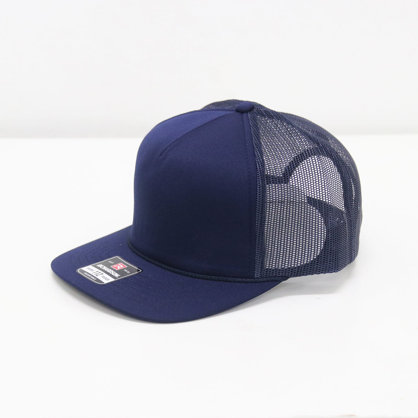 Navy blue cap with mesh back on a white background