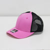 Pink and black baseball cap on a white background