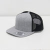 Gray and black trucker cap on a white background