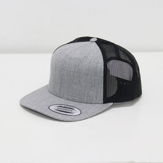 Gray and black trucker cap on a white background