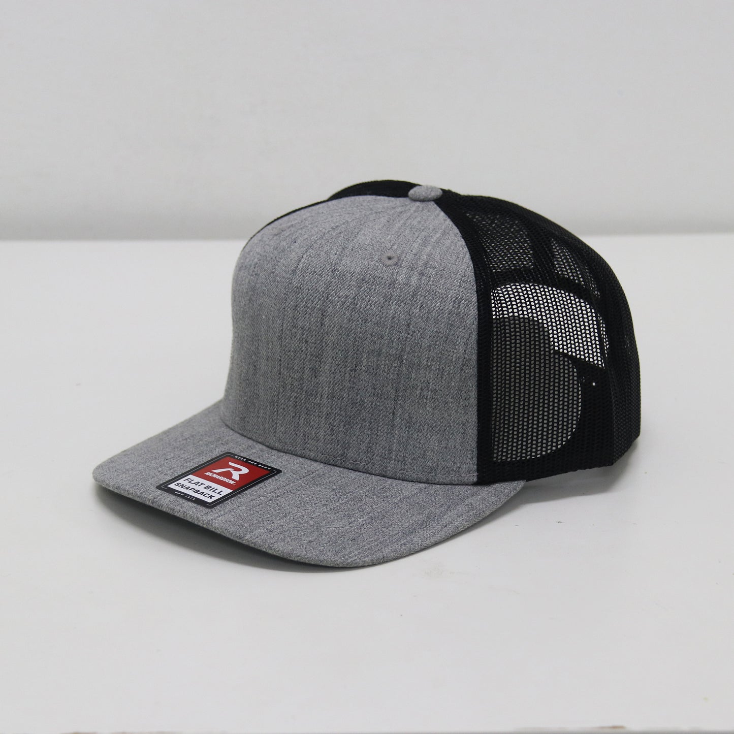Gray and black baseball cap with a brand logo on a white background