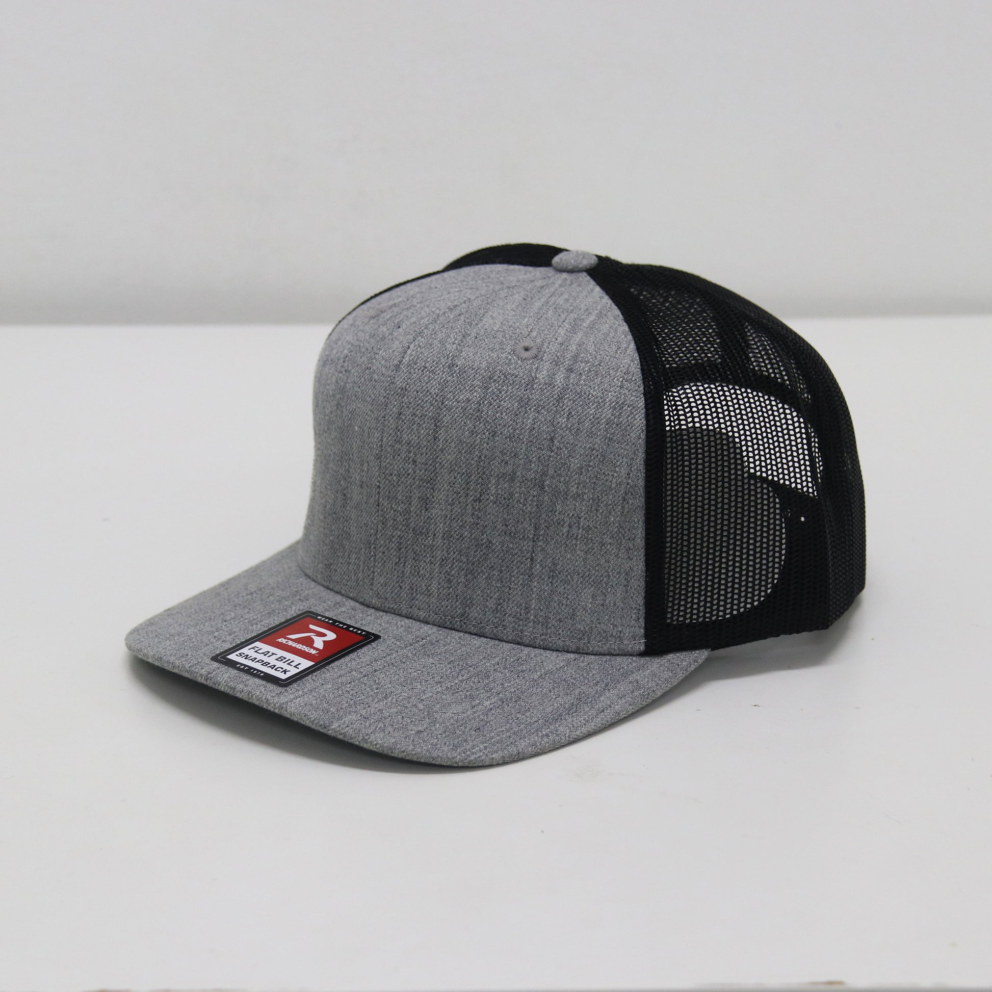 Gray and black baseball cap with a brand logo on a white background