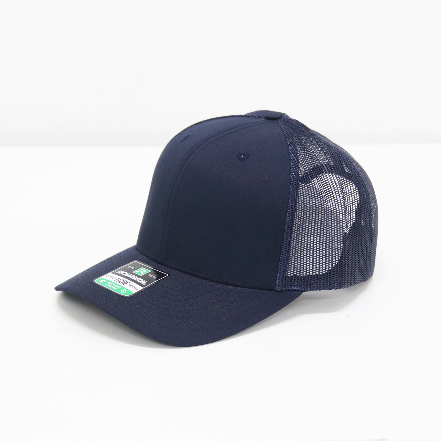Navy blue cap with mesh back on a white background