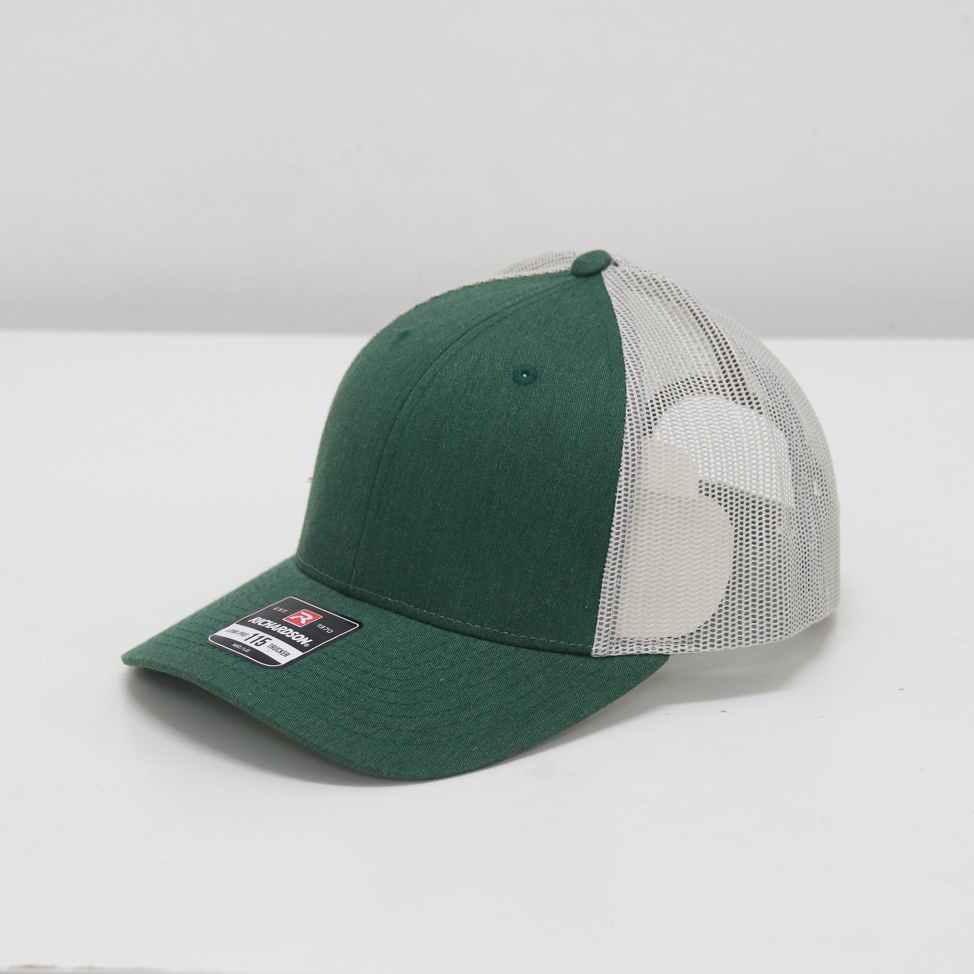 Green and white cap with mesh back on a white background