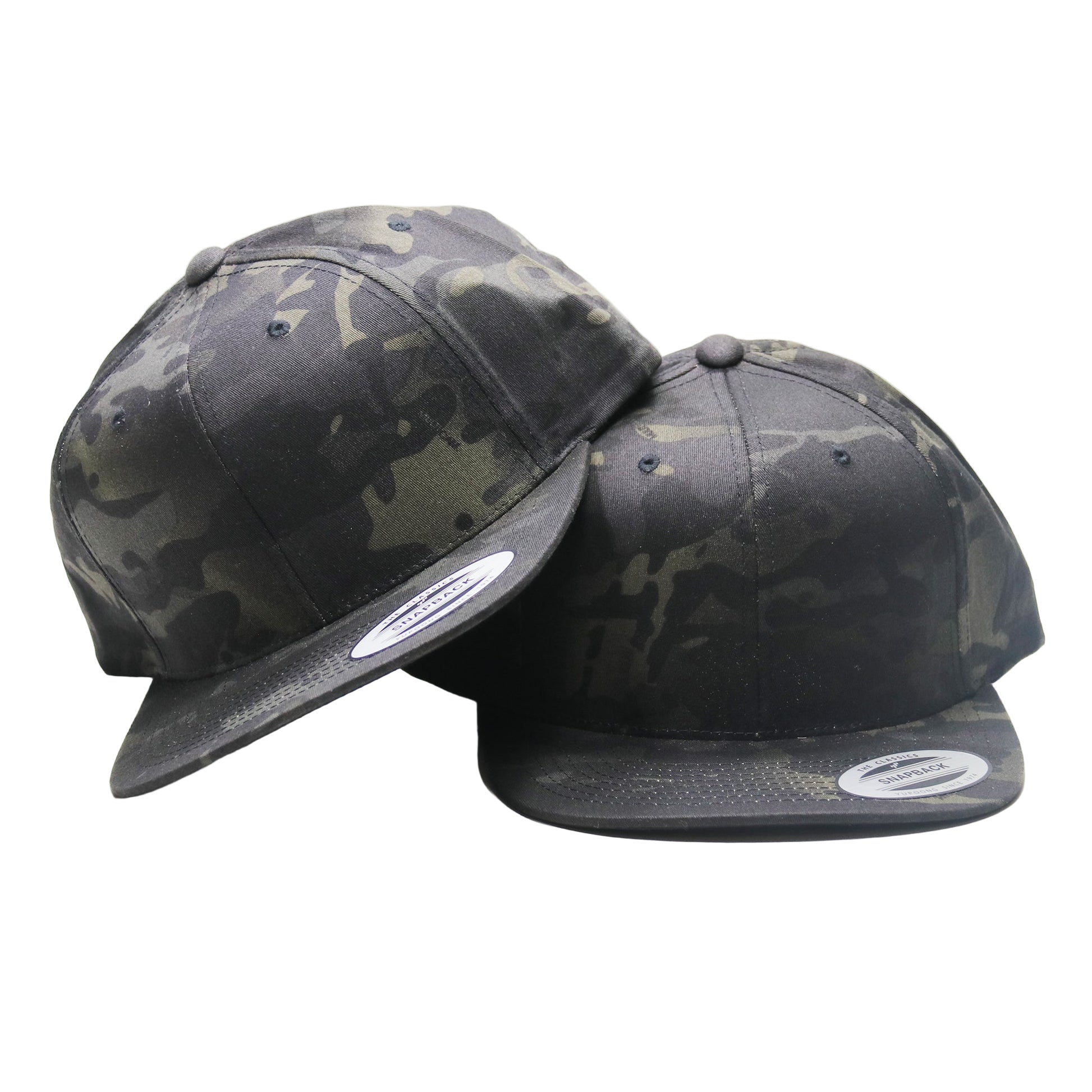 Two camouflage baseball caps on a white background