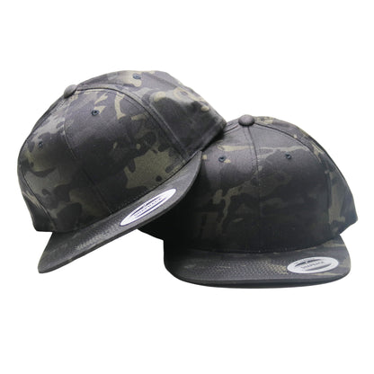 Two camouflage baseball caps on a white background