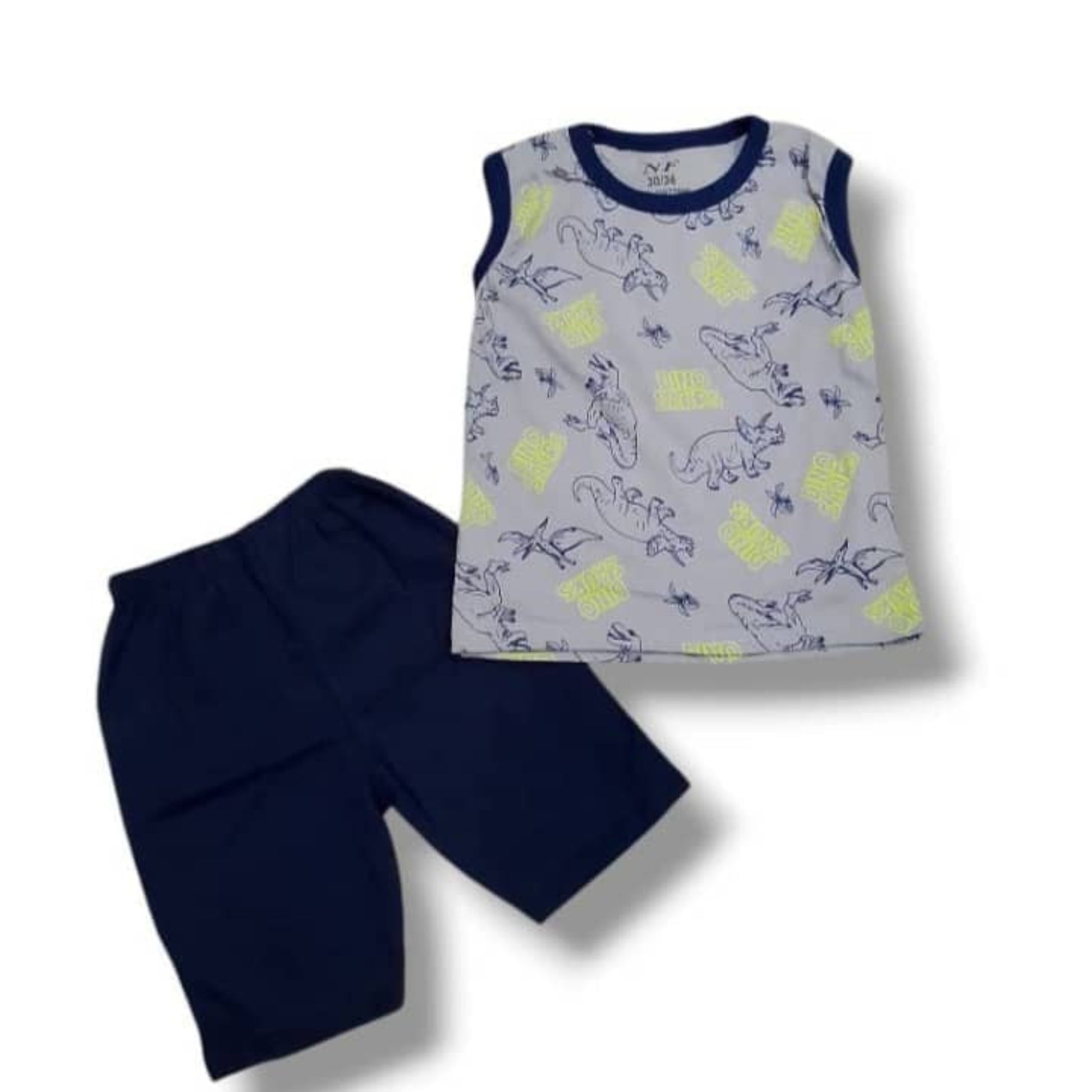 Children's sleeveless top with pineapple pattern and navy shorts on a white background