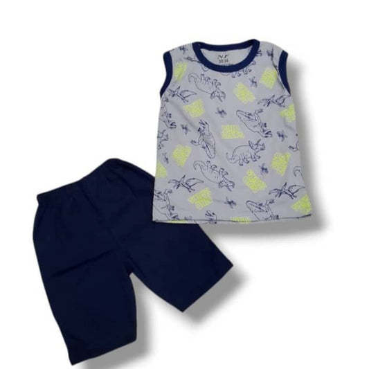 Children's sleeveless top with pineapple pattern and navy shorts on a white background