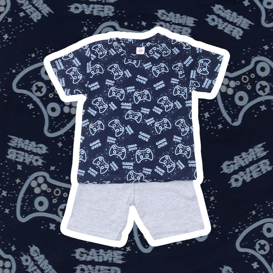 Children's outfit with blue t-shirt and gray shorts on a dark background with gaming-themed text.