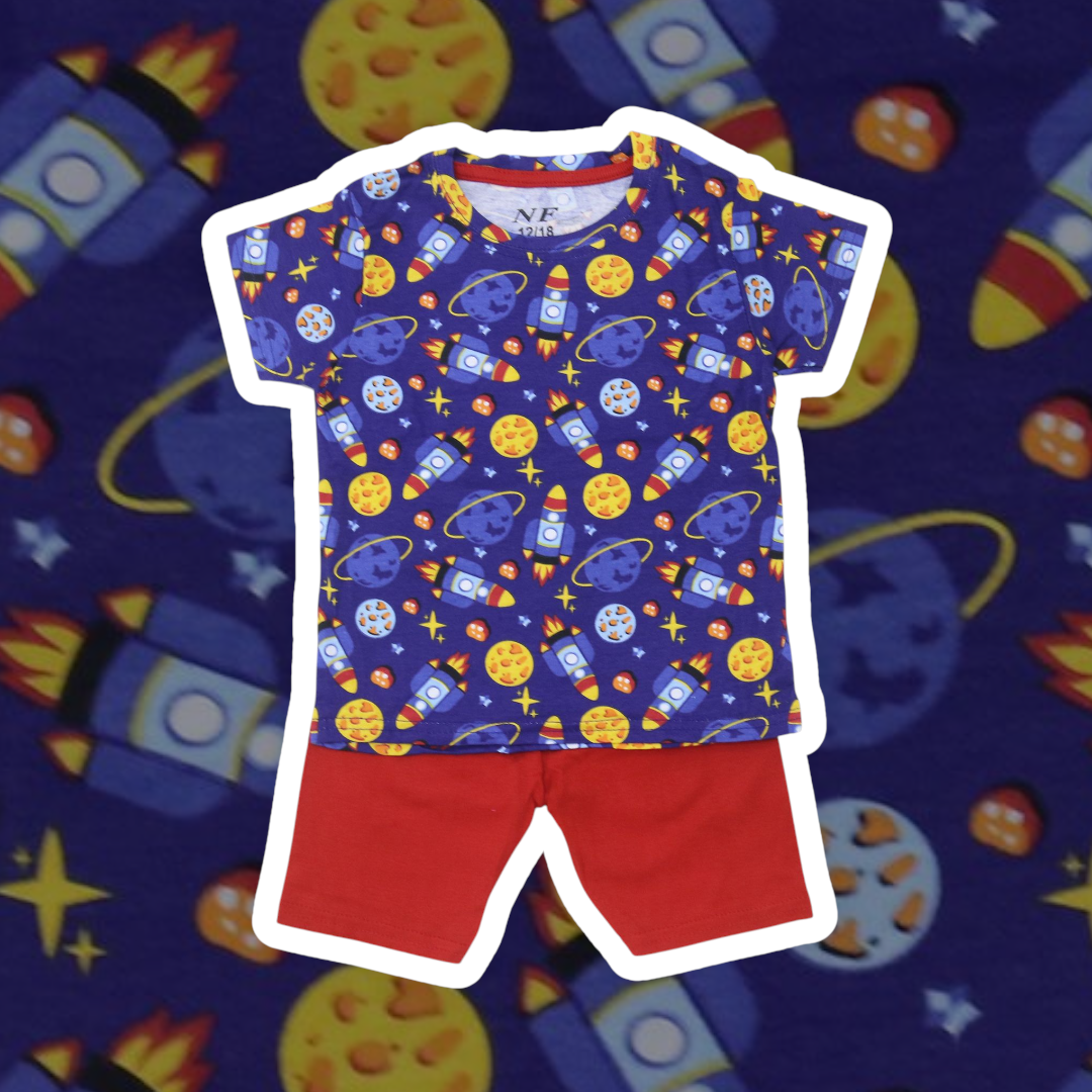 Children's outfit with space-themed shirt and red shorts on a colorful space-themed background