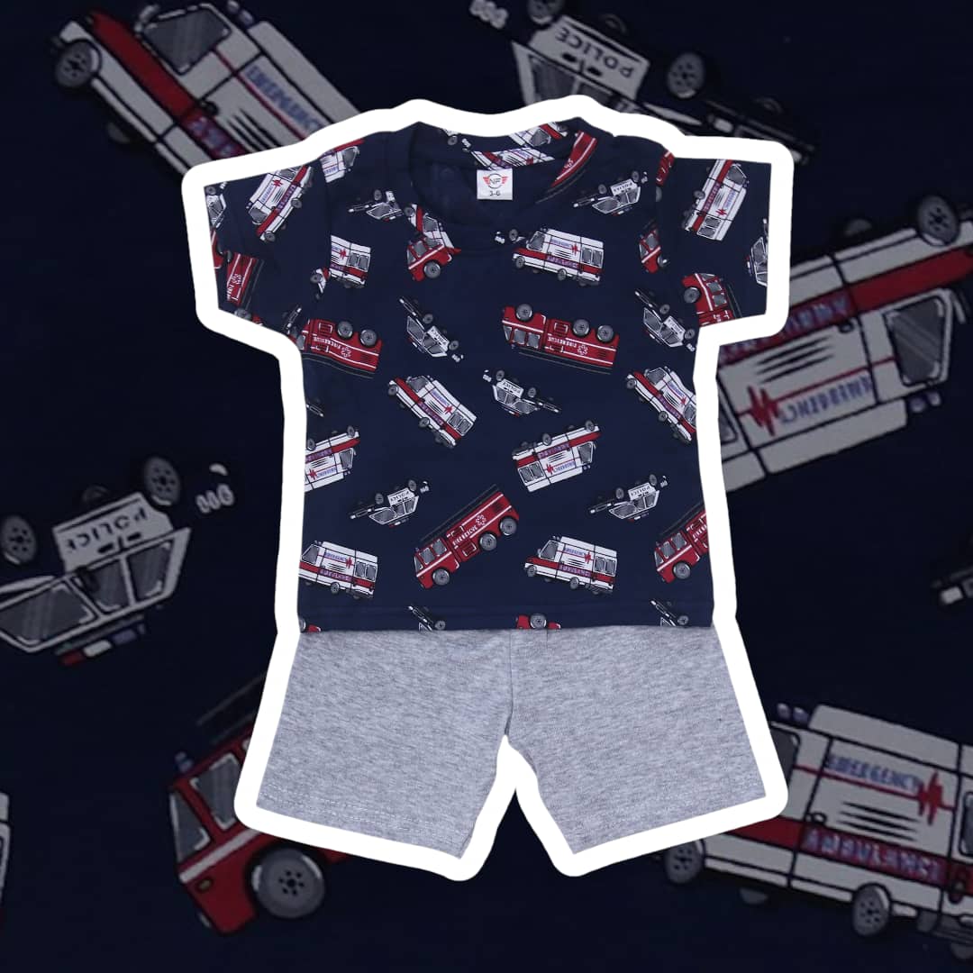 Children's t-shirt with fire truck pattern and gray shorts on a dark background with medical vehicle illustrations.