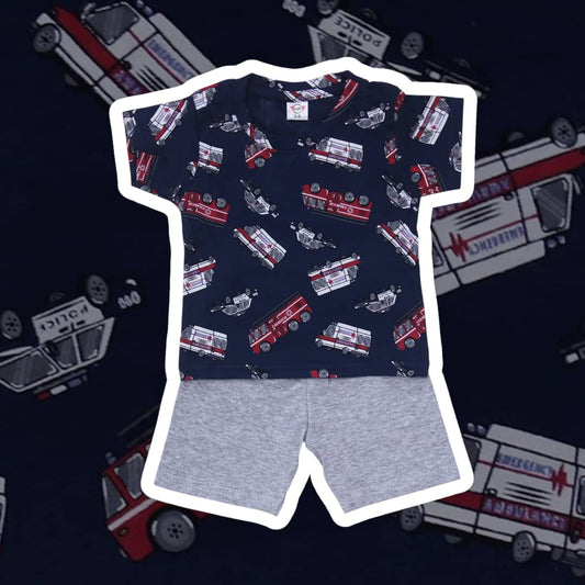 Children's t-shirt with fire truck pattern and gray shorts on a dark background with medical vehicle illustrations.