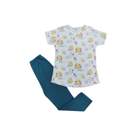 Floral top and teal pants set on a white background
