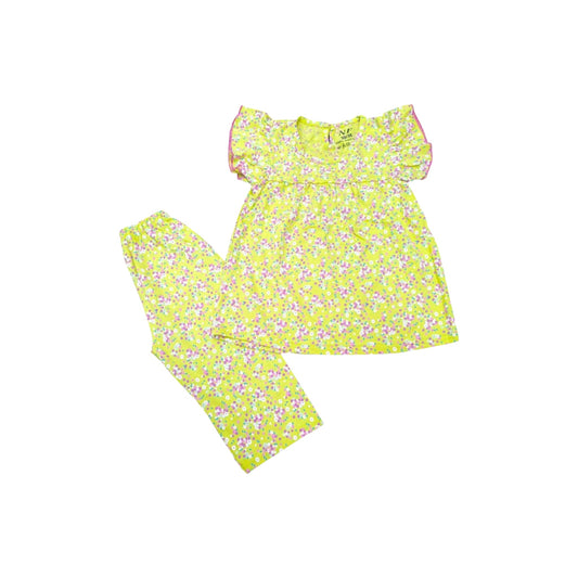 Yellow floral dress and leggings set on a white background