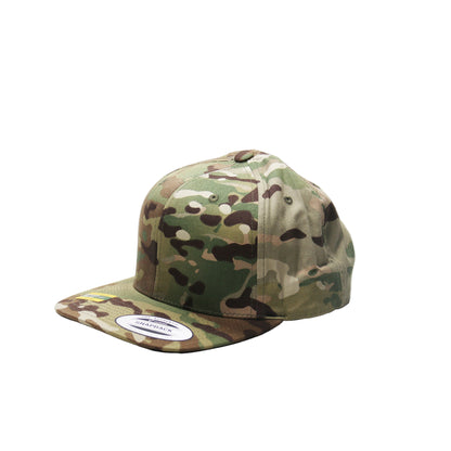 Camouflage cap on a white background