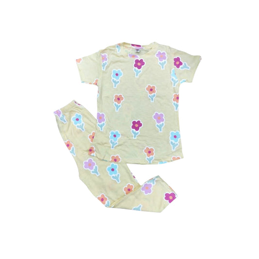 Children's pajama set with floral pattern on a white background