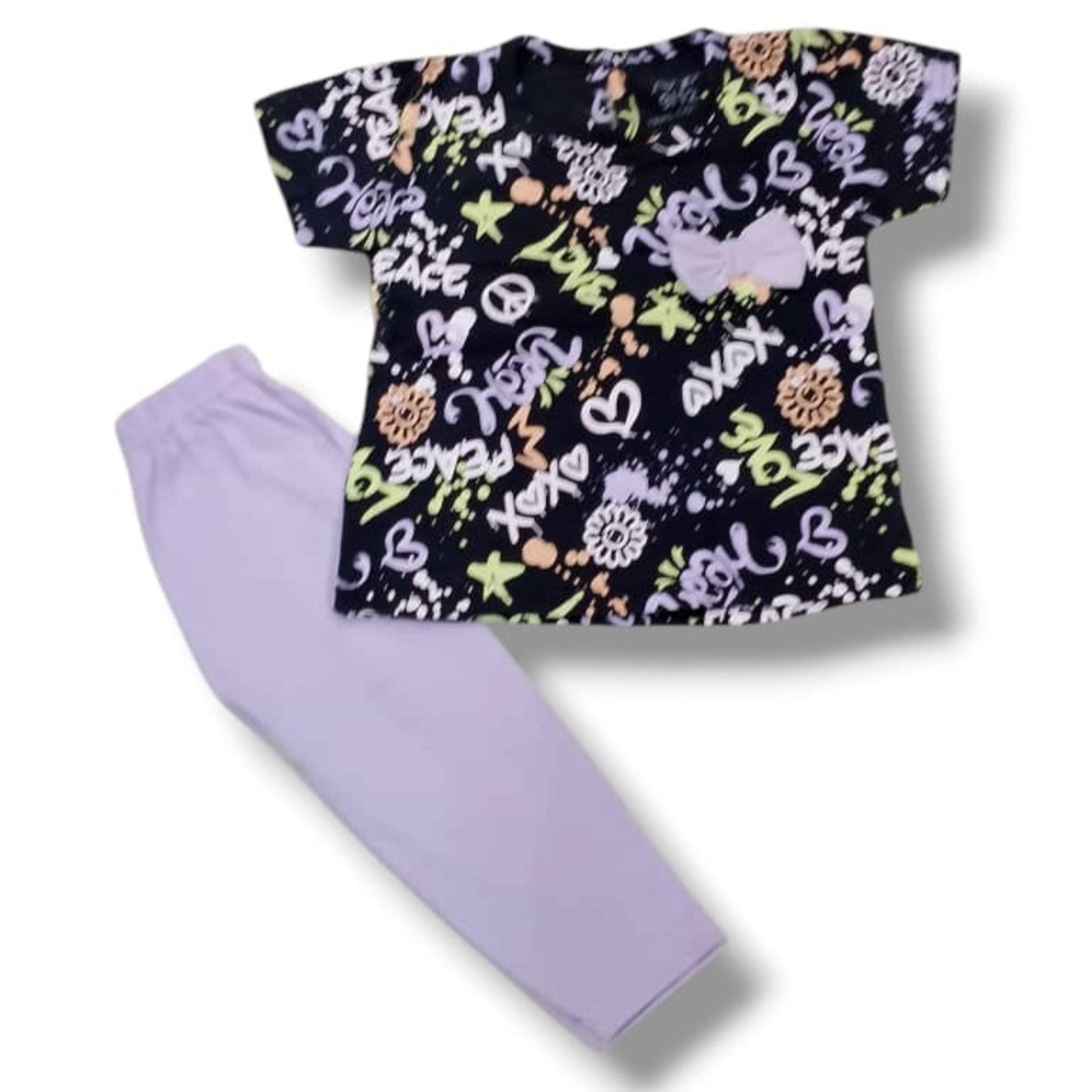 Children's outfit with a patterned top and lavender pants on a white background