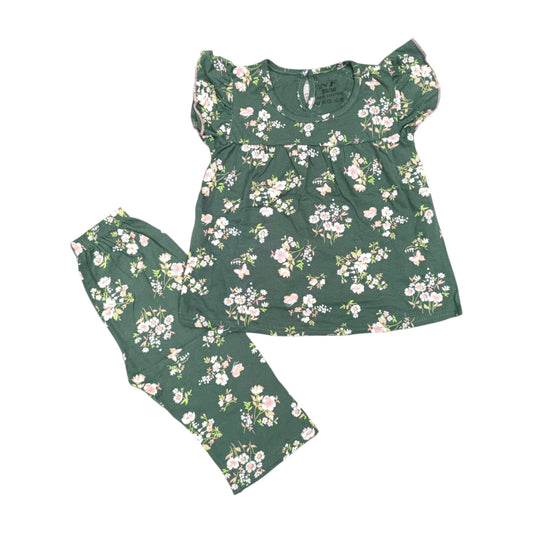 Green floral pajama set on a white background
