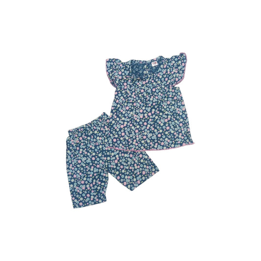 Floral pajama set with top and shorts on a white background